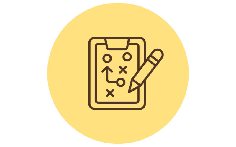 A yellow circle with a brown outline of a clipboard and pencil. The clipboard displays a strategy plan with circles, crosses, and an arrow indicating movement.